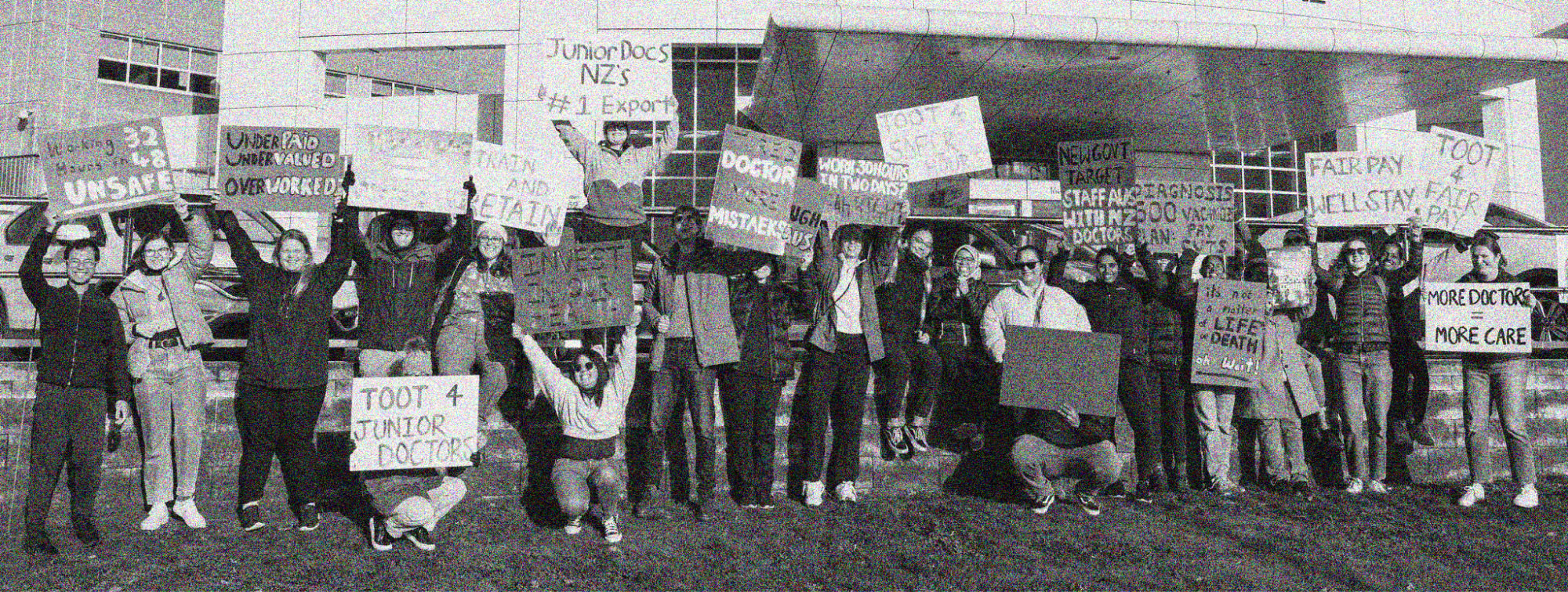 Group of junior doctors protesting holding picket signs