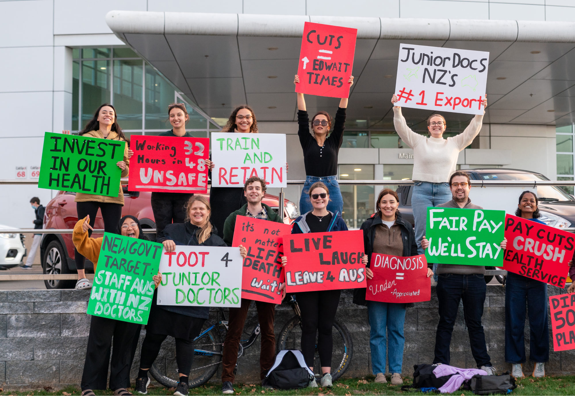 Group of junior doctors protesting holding picket signs